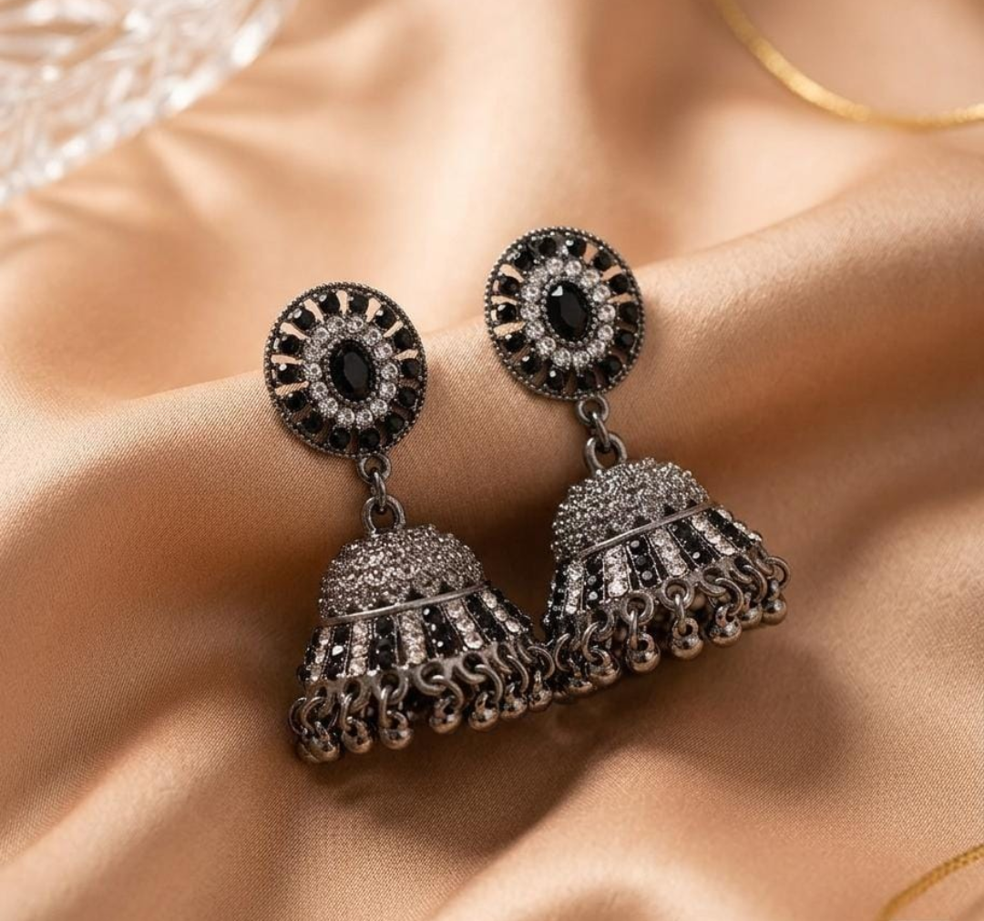 "Timeless jhumkas ✨ adding elegance to every look 🖤”