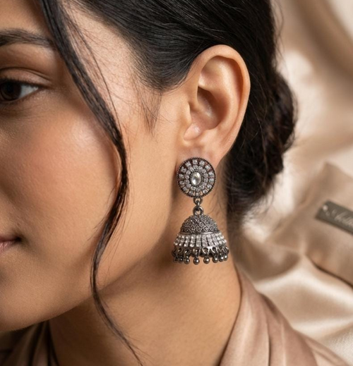"Timeless jhumkas ✨ adding elegance to every look 🖤”