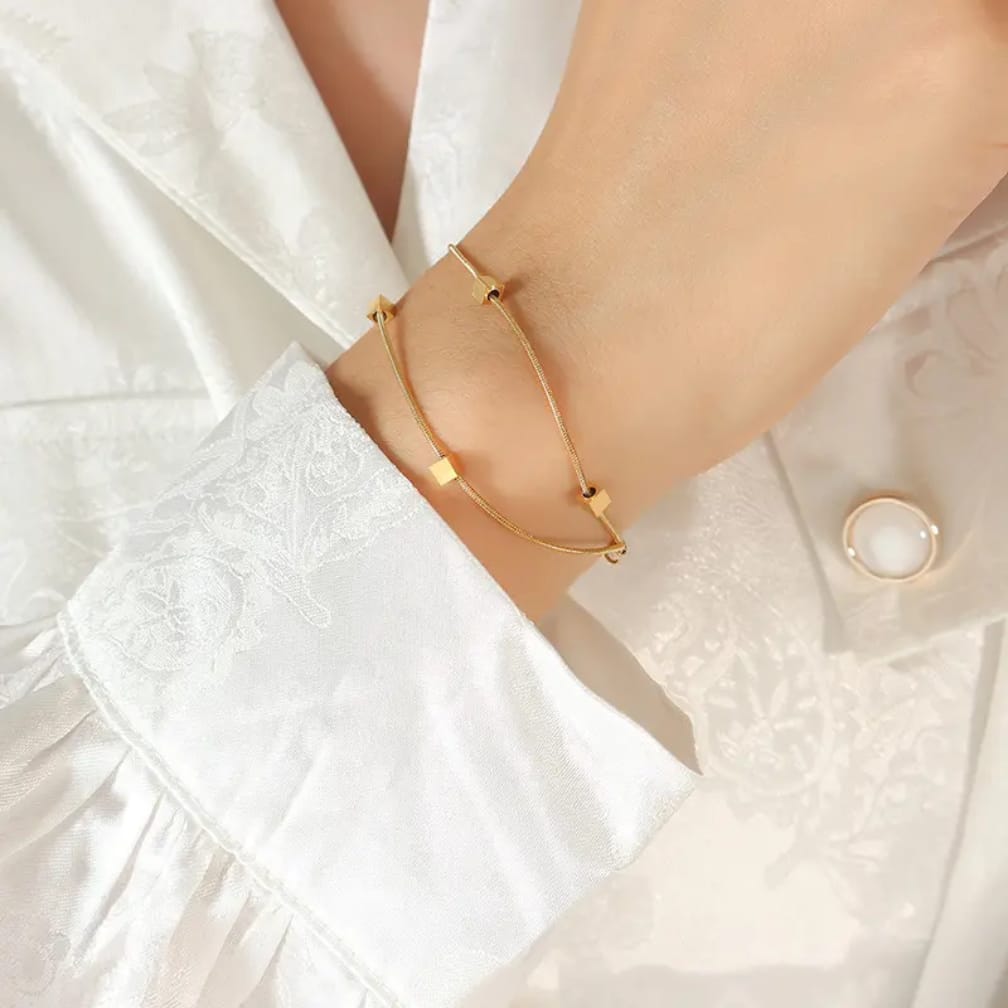 Sleek snake chain bracelet with floating gold cubes ✨️ stainless steel bracelet
