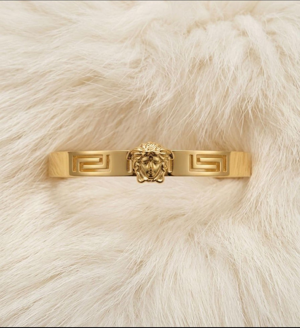 "Effortless chic with this stunning gold Greek key bangle"