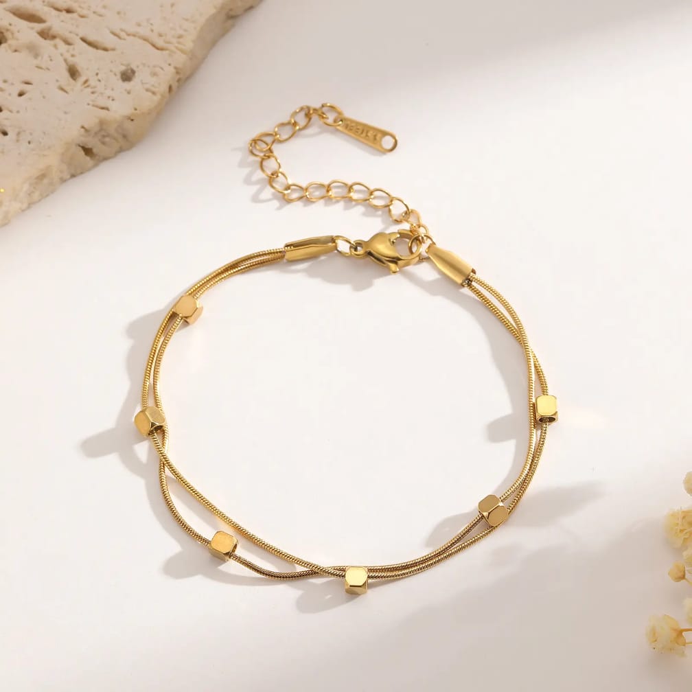 Sleek snake chain bracelet with floating gold cubes ✨️ stainless steel bracelet