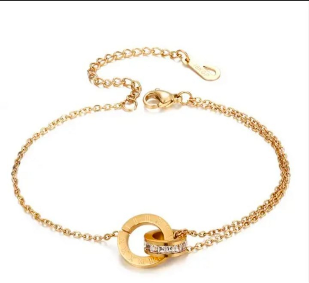 “Elegant gold bracelet with double‑circle charm set