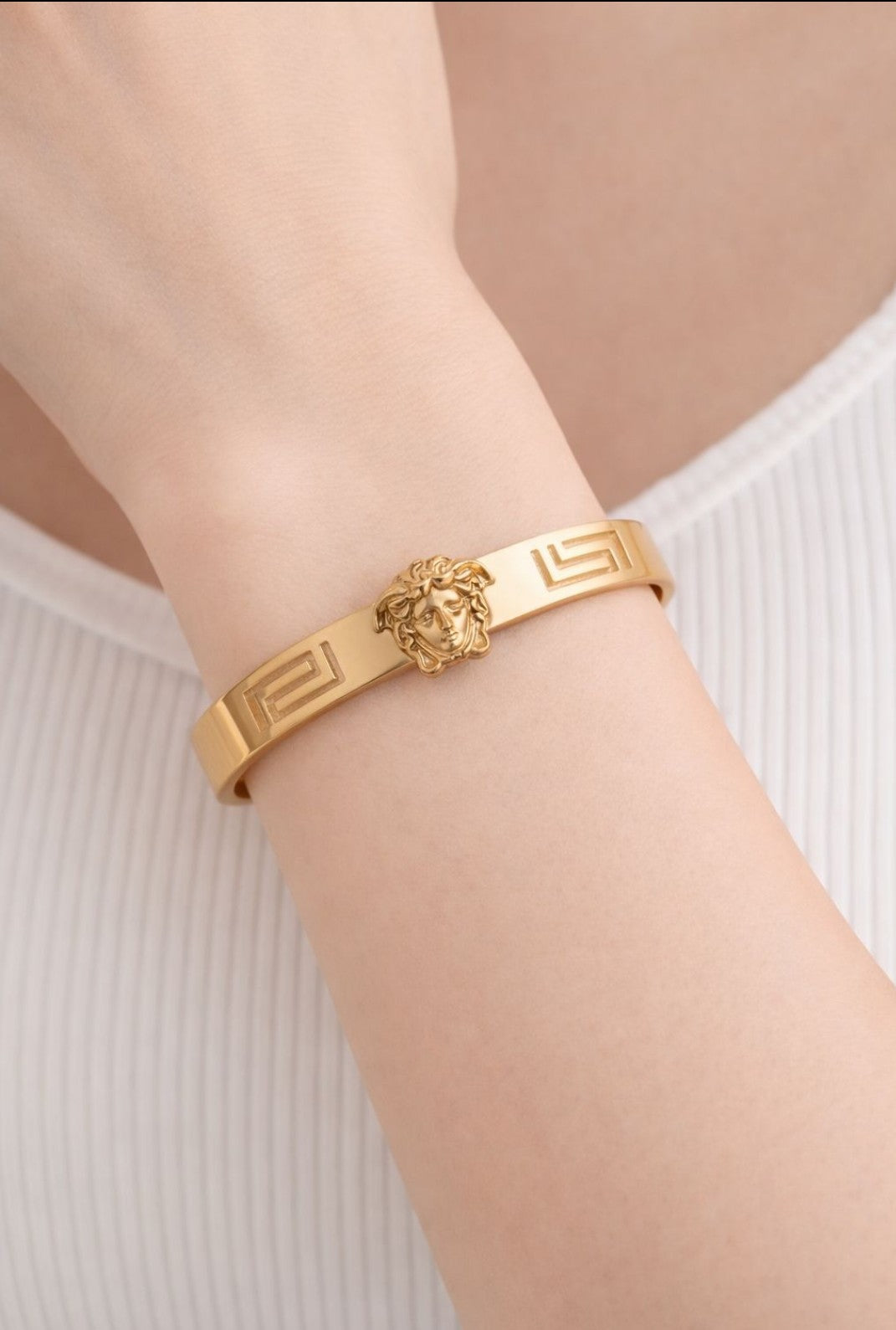 "Effortless chic with this stunning gold Greek key bangle"