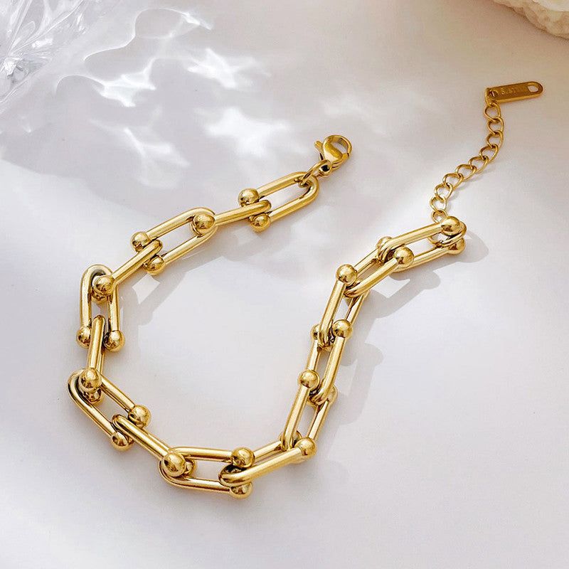 “Not just a bracelet — a statement ✨ Where bold links and golden orbs meet timeless style"