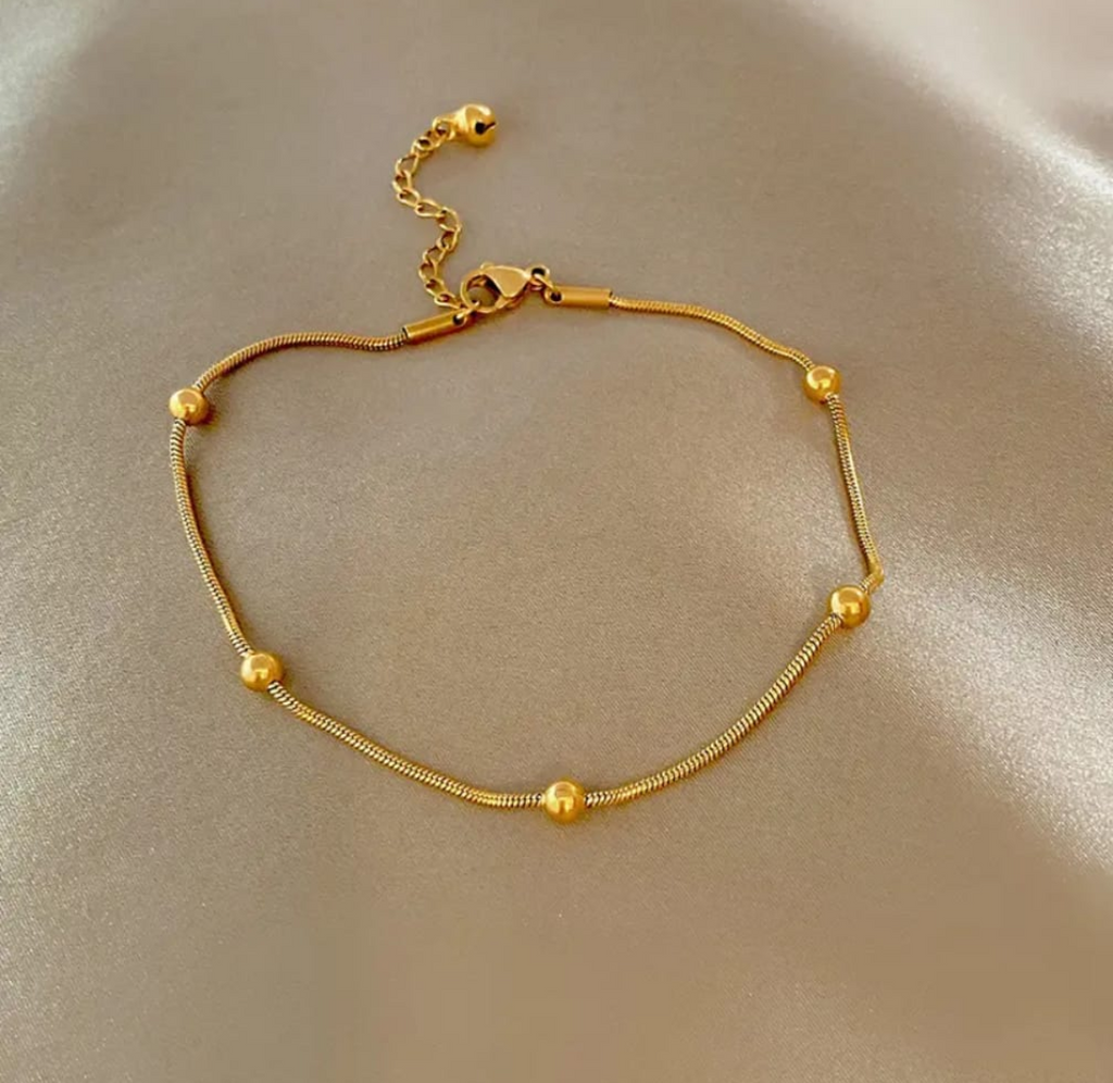 “Step in style with this sleek gold anklet"