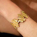 Bold gold leaf cuff that wraps your wrist in luxury💫 stainless steel cuff
