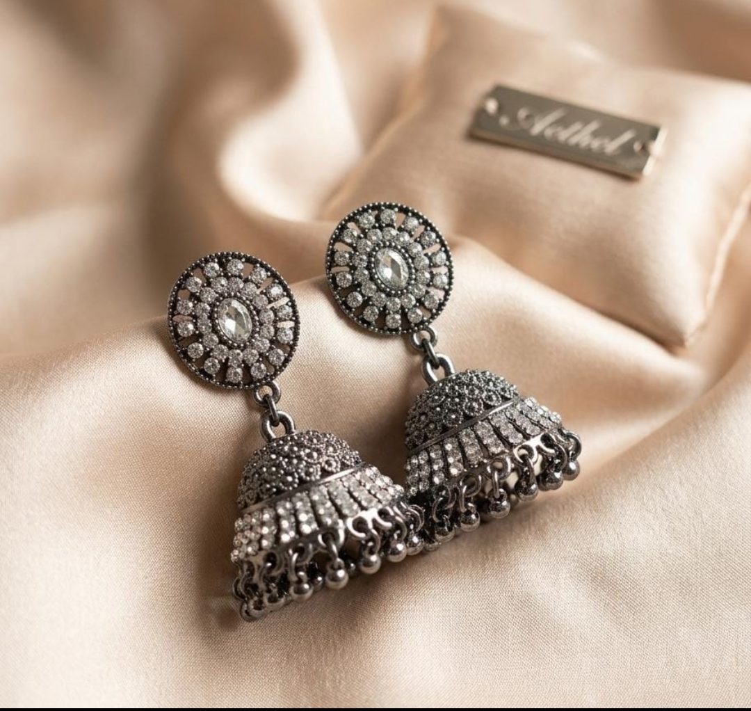 "Timeless jhumkas ✨ adding elegance to every look 🖤”