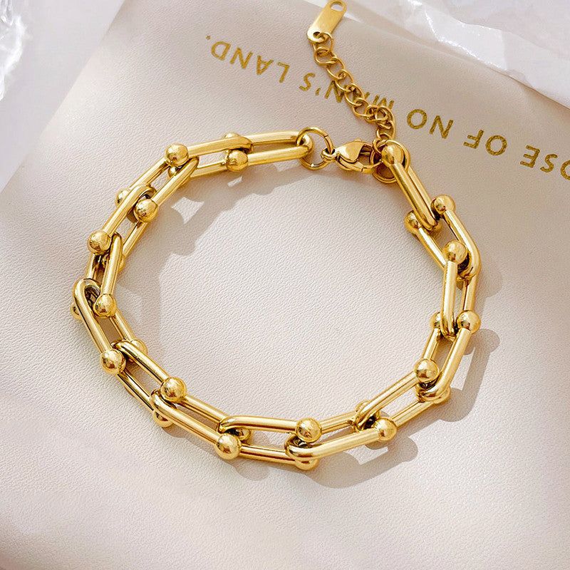 “Not just a bracelet — a statement ✨ Where bold links and golden orbs meet timeless style"