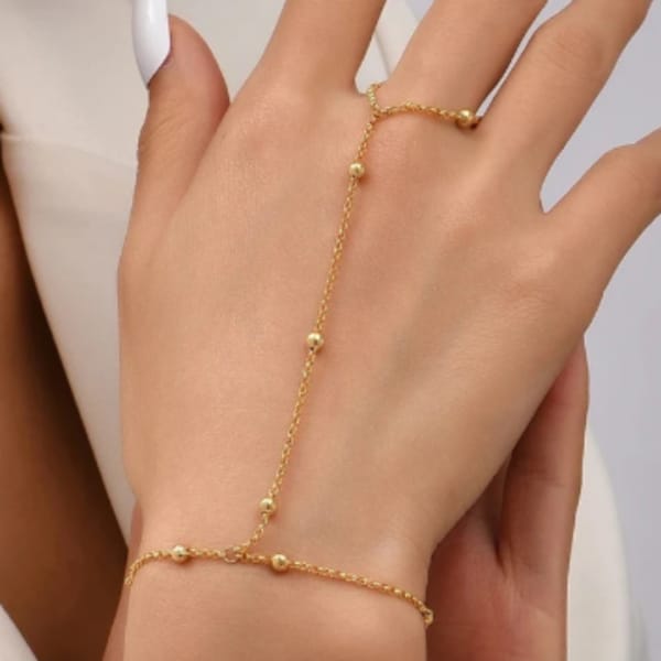 “Delicate details, bold statement ✨ This gold hand chain adds the perfect touch of luxe to any look "