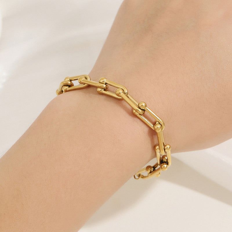 “Not just a bracelet — a statement ✨ Where bold links and golden orbs meet timeless style"