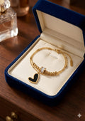 Double chain bracelets with enamel black/white heart, gold beads & crystal charm